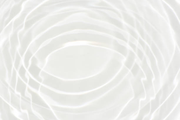 istock White water with ripples on the surface. Defocus blurred transparent white colored clear calm water surface texture with splashes and bubbles. Water waves with shining pattern texture background. 1783415281
