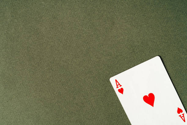 istock Ace playing card on green background close up 1783420905