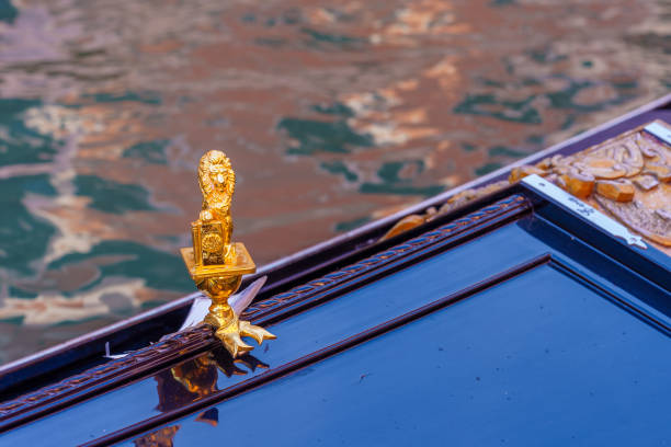 View of a typical golden lion on a gondola, in Venice, Veneto, Northern Italy