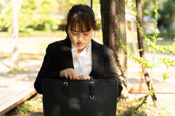 istock A woman in a suit resting on a bench 1783429629