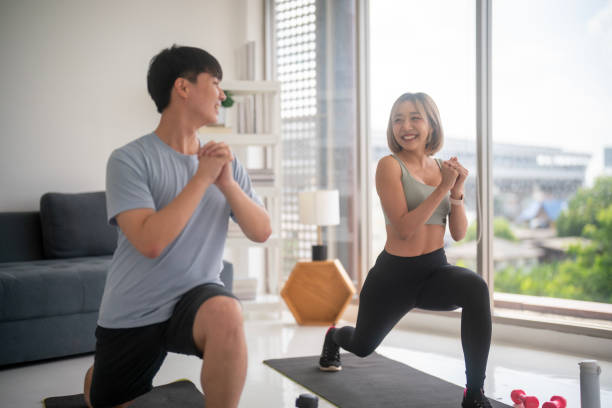 istock Couple exercising together at home. 1783460298