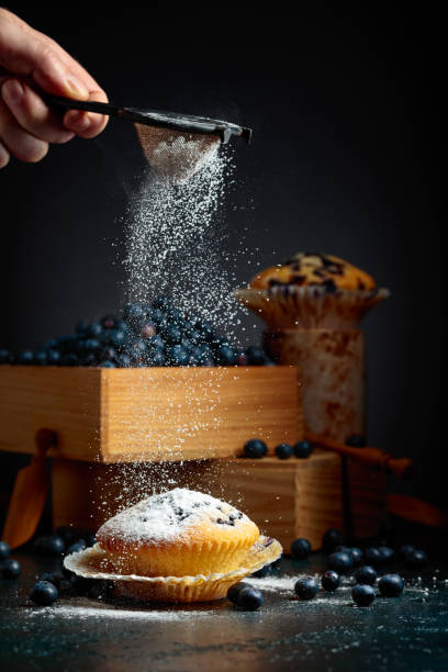 istock Blueberry muffins and berries in a wooden box. 1783463213
