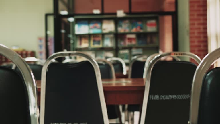 Empty tables and chairs in the reading area of ​​the library