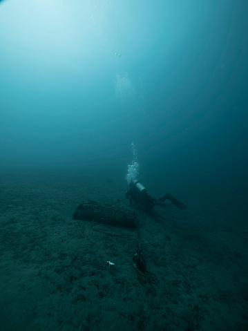 Scuba diver explores turquoise ocean depth of Philippines
