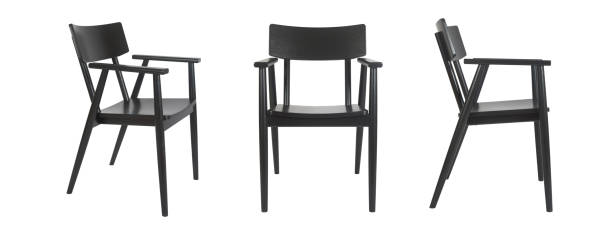 Set of three black wooden chairs in different view angles over white