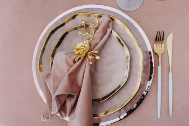 istock tableware Glasses, flower fork, knife served for dinner in restaurant with cozy interior 1783480476