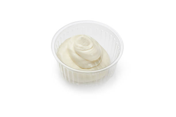 istock Soft cream cheese in plastic bowl on white background 1783481054