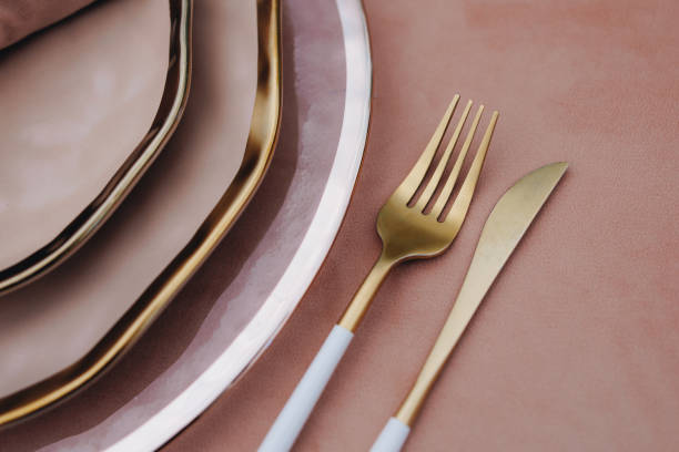 istock tableware Glasses, flower fork, knife served for dinner in restaurant with cozy interior 1783481599
