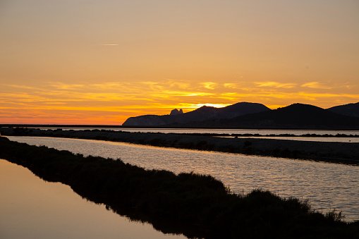 Beautiful sunset at Ses Salines beach in Ibiza island in Spain.