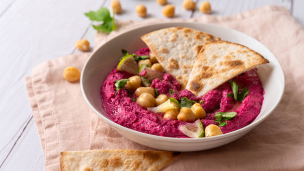istock Close-up of Beetroot hummus on white table 1783507141