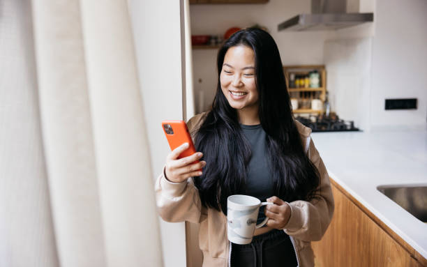 istock Young woman drinking coffee in a kitchen 1783512025