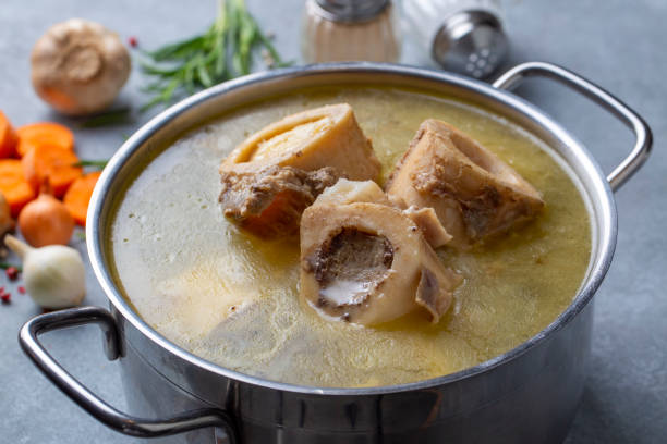 istock Boiled bone and broth. Homemade beef bone broth is cooked in a pot on. Bones contain collagen, which provides the body with amino acids, which are the building blocks of proteins. 1783525788