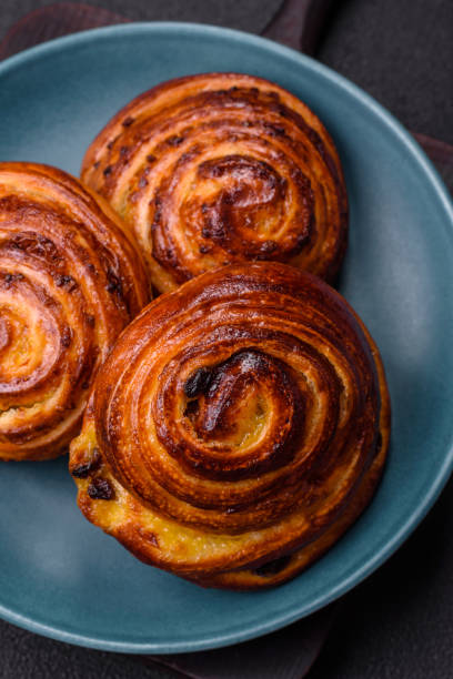 istock Delicious baked cinnamon raisin rolls in the form of rolls 1783533603
