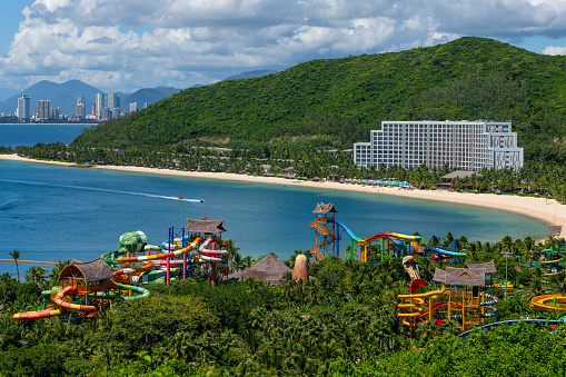View of the water park, the sea bay and the Vietnamese city of Nha Trang on a sunny cloudy day