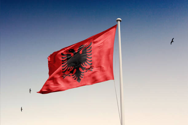 Albania flag fluttering in the wind on sky.