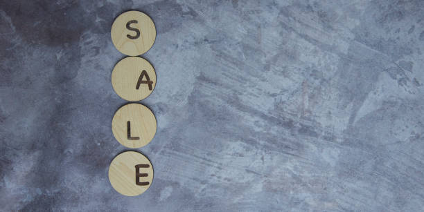 istock Word SALE on wooden cubes on blue background. 1783556185