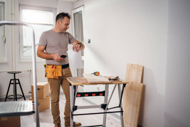 istock A handyman looking at his watch. 1783558047