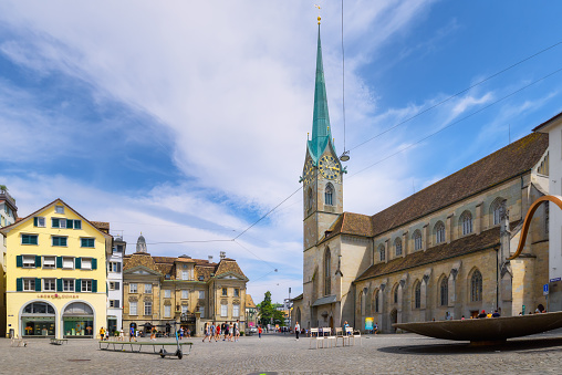 Zurich, Switzerland - June 18, 2023: Panoramic view of the historical center of Zurich with the famous Fraumunster church on a sunny day with blue sky, canton of Zurich, Switzerland