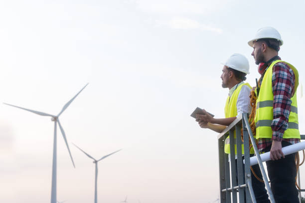 istock Two technicians engineers working in wind turbine electricity plant. Renewable energy solution for climate change 1783563843