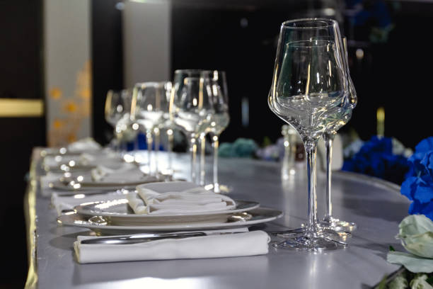 istock tableware Glasses, flower fork, knife served for dinner in restaurant with cozy interior 1783567110