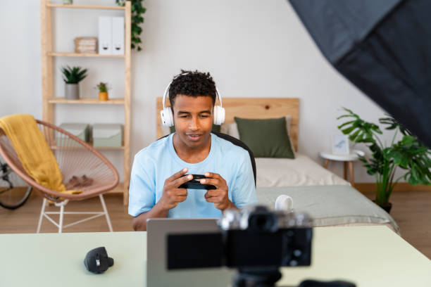 istock Male streamer recording online video game at home. 1783570152