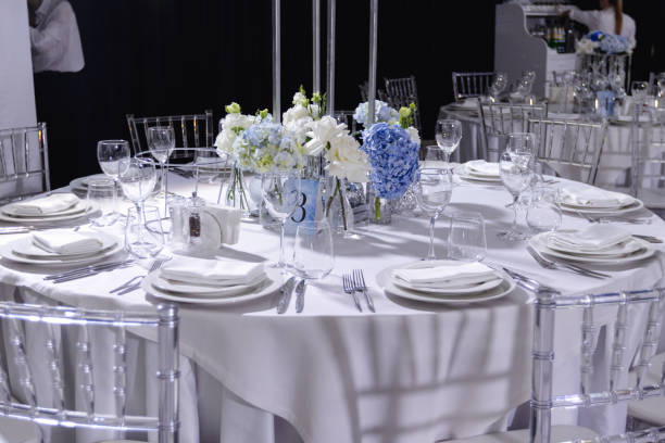 istock tableware Glasses, flower fork, knife served for dinner in restaurant with cozy interior 1783570799