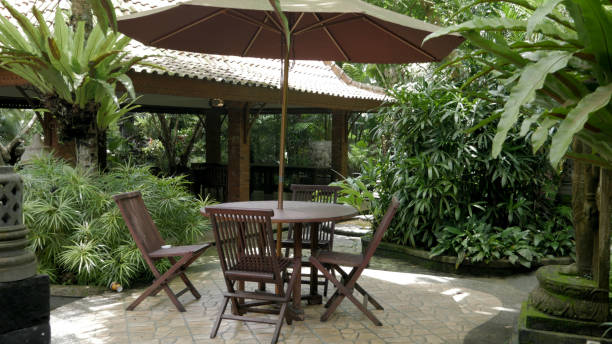 istock Wooden Chairs and table with Umbrella 1783576523