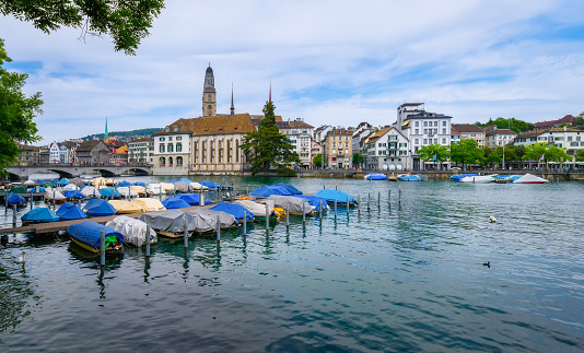 Lake Zurich in Switzerland. Boats at Limmat river. View from the city of Zurich on a clear sunny day.