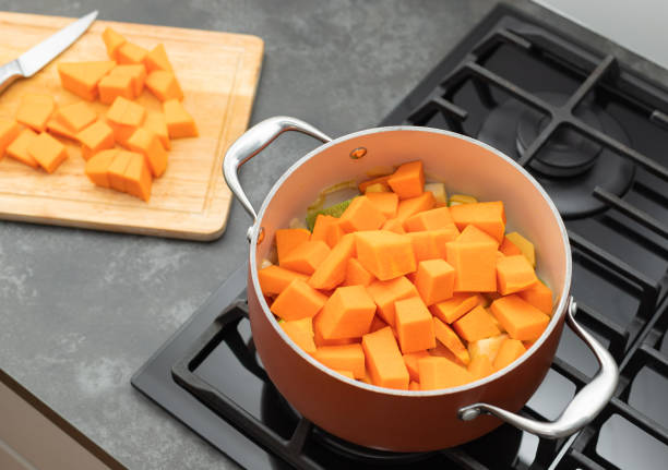 istock preparing pumpkin soup in a pot on gas stove top 1783579748