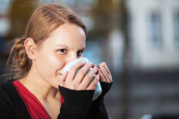 istock Pretty young woman with cup of chocomilk 178359126