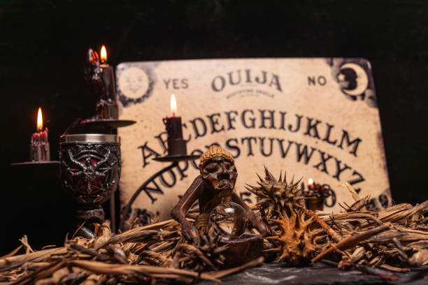 istock Magic still life with burning candelabrum, evil candles. Black magic ritual with occult, evil and esoteric symbols. 1783595502