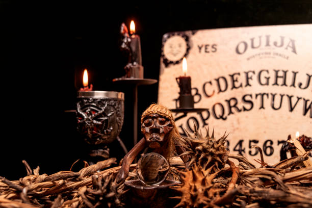 istock Magic still life with burning candelabrum, evil candles. Black magic ritual with occult, evil and esoteric symbols. 1783595510