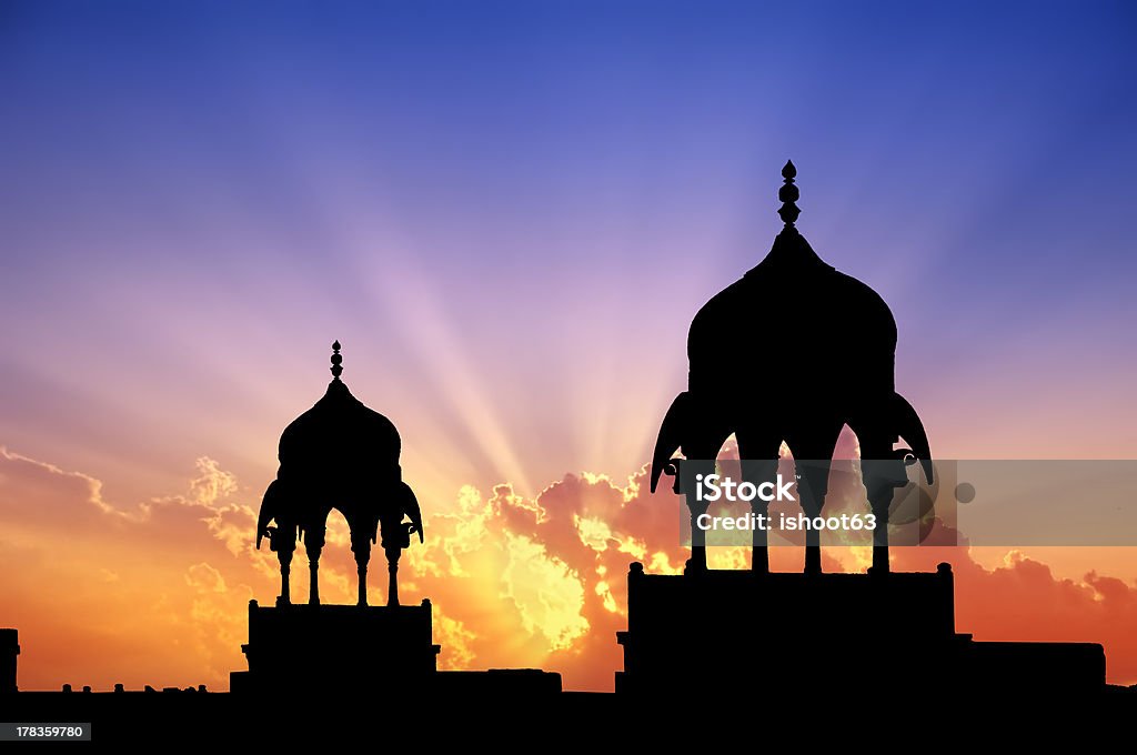 Bikaner pavilions "Mogul style pavilions silhouettes at sunset of a Maharajah palace in Bikaner, Rajasthan, India." Architectural Column Stock Photo