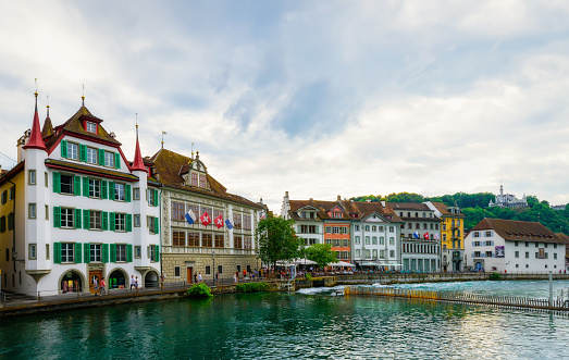 Lucerne, Switzerland - June 18, 2023: Historic city center on the Reuss river in the city of Lucerne. Popular travel destination. A walk through the city.