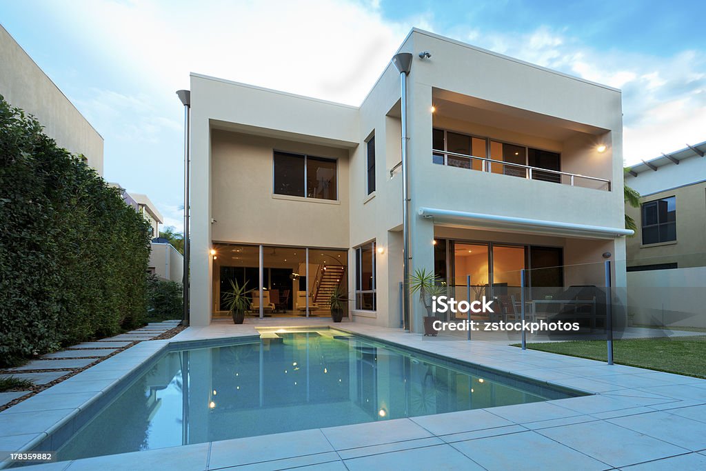 Luxury home Luxurious modern house with swimming pool and backyard House Stock Photo