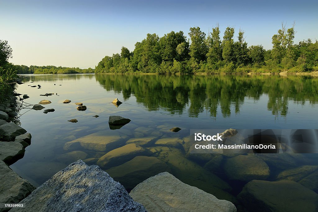 Ticino river in Novara area "Ticino river, known as Blu River, flowing on the Novara area in Piemonte, Italy.The natural area all around is peaceful and relaxing" Horizontal Stock Photo