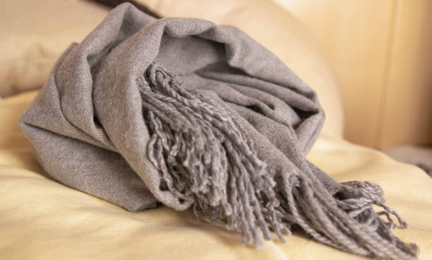 istock Knotted soft warm gray scarf. Winter textiles 1783601971