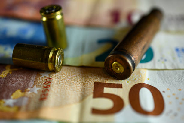 gun resting on a banknote carpet