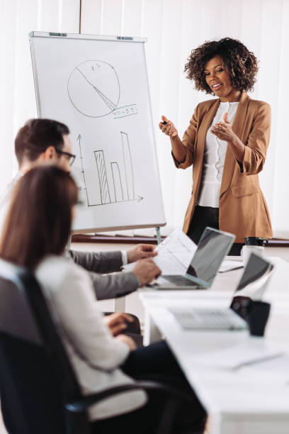 istock African american female executive manager talking with colleagues 1783615835