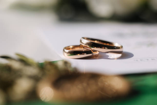 istock Macro photo of wedding rings on oaths 1783618319