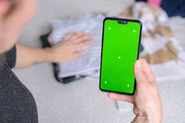 istock Smartphone with Chroma Key Green Screen close-up. Buying Used Second Hand recycled clothes. Home sale. Recycling Eco New Life, European Store. 1783620128