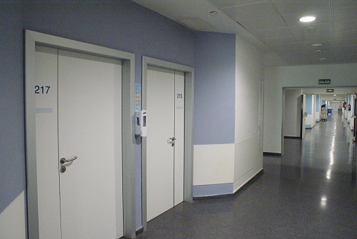 Hospital hallway with doors to the rooms