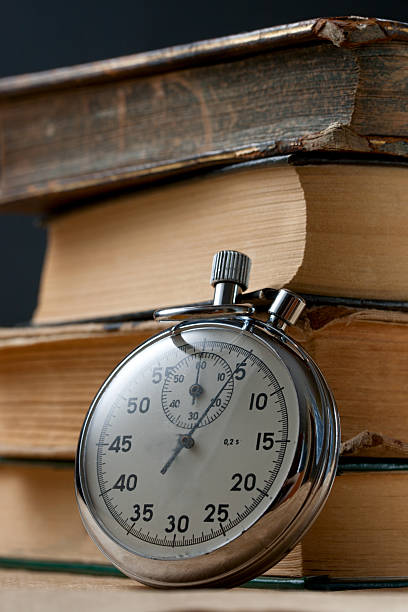istock Pile of old books and stopwatch 178362912