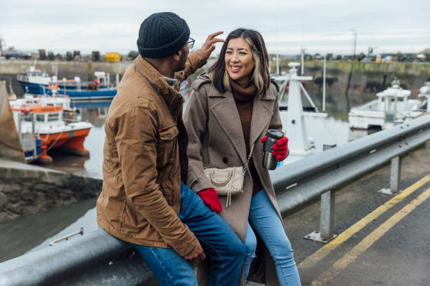 istock Heterosexual Couple Flirting by the Sea 1783630640