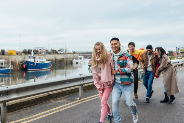 istock Friends Walking Along the Harbour 1783632426