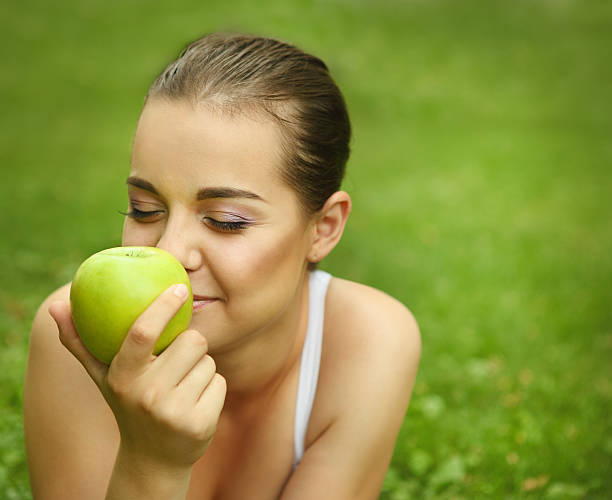 istock Beautiful young girl with green apple 178363349