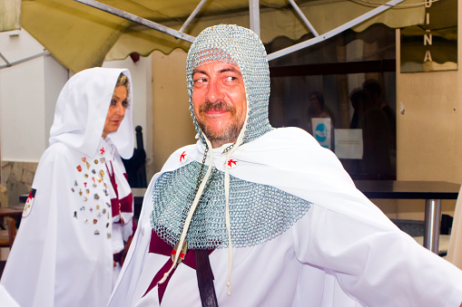 Historical reenactment, templar knights. Medieval Festival ,period clothings, parade along the street .  Mondoñedo medieval historical reenactment. Lugo province, Galicia, Spain.