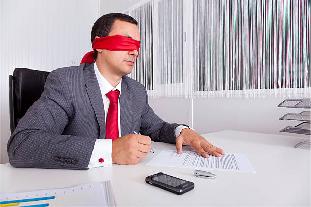 istock Blindfold businessman working with his laptop 178363545