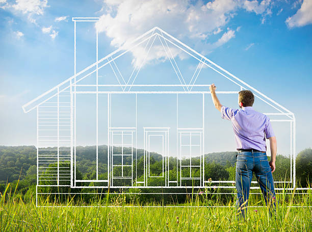 istock Man drawing a blue print of house in nature 178363885