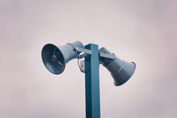 istock Tall column with two loudspeakers against cloudy sky. 1783642812